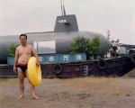 Beached submarine houseboat in China.