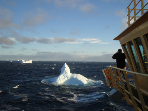 Dr. Martin Truffer photographs an iceberg in the tumultuous Bransfield Strait.